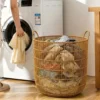 cn-11134207-820l4-mpbz3w7etfy8c5.webp Bakul Baju Rattan Cylinder Style with Handle Modern Metal Frame Laundry Organiser